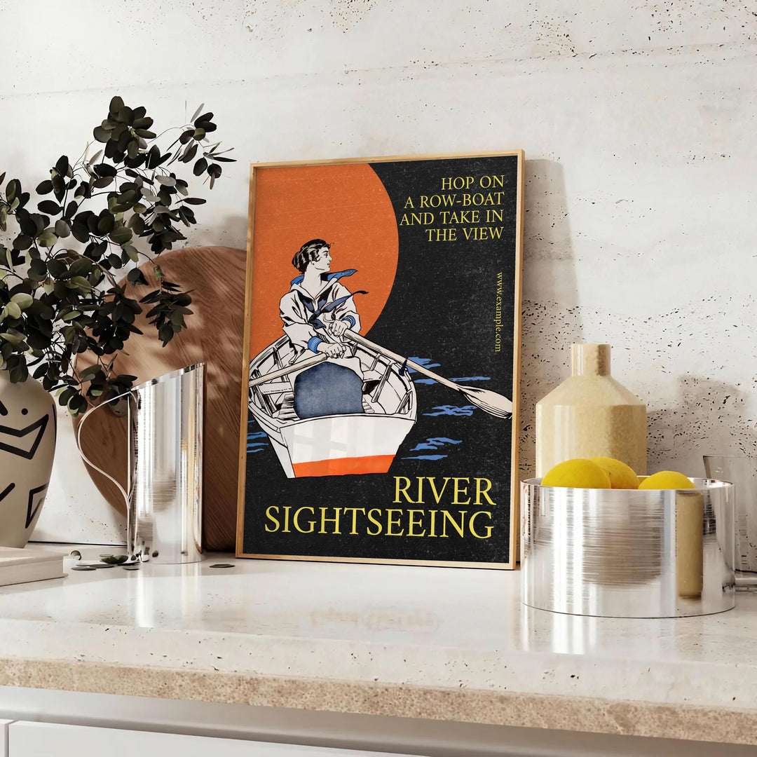 A serene boat sailing on calm waters, with gray and black tones. - styled on a counter with eucalyptus and a bowl of lemons