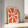 Abstract shapes in warm browns and oranges with a bohemian style - leaning on a herringbone floor against a white panelled wall