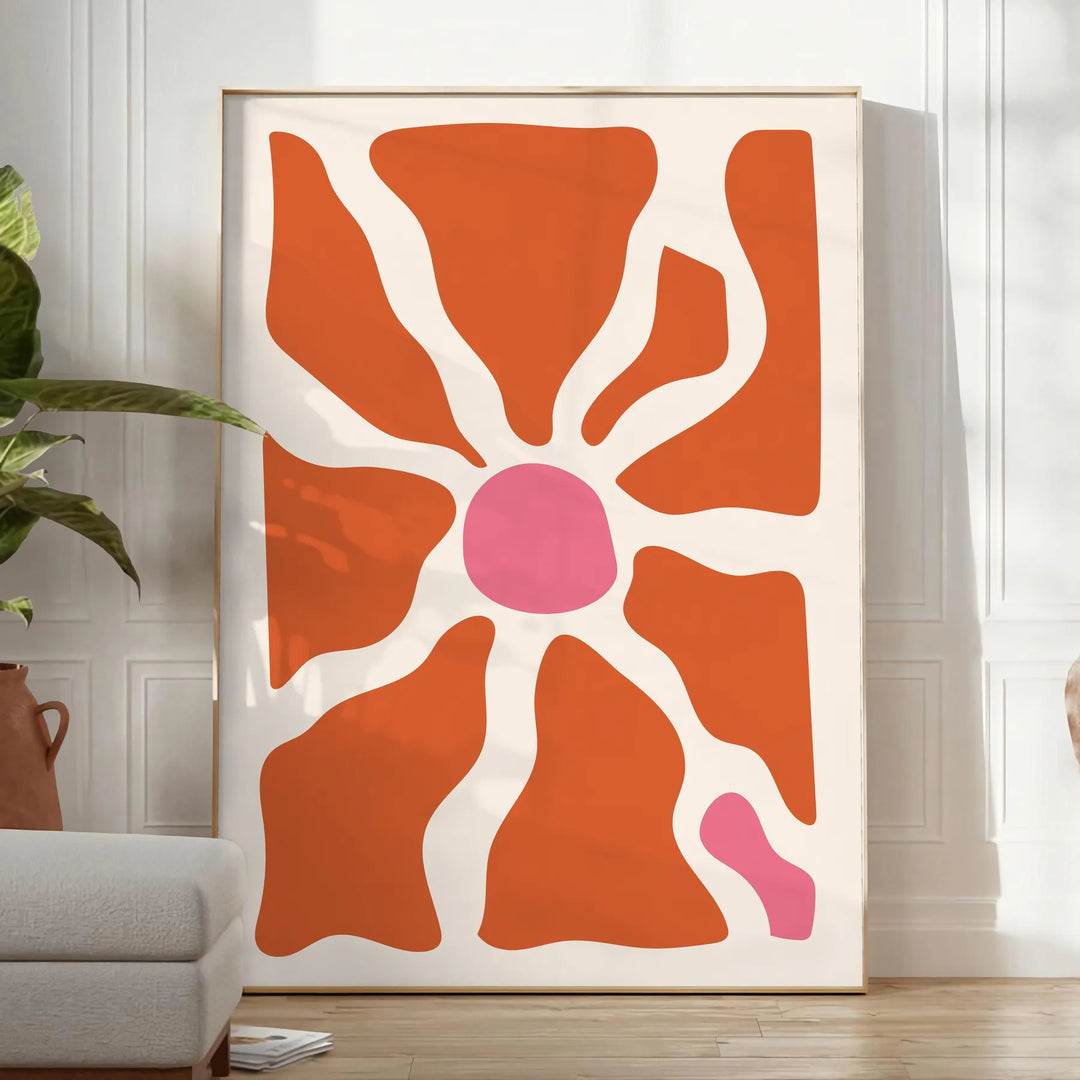 Abstract shapes in warm browns and oranges with a bohemian style - in a bright minimalist room with a plant and an armchair