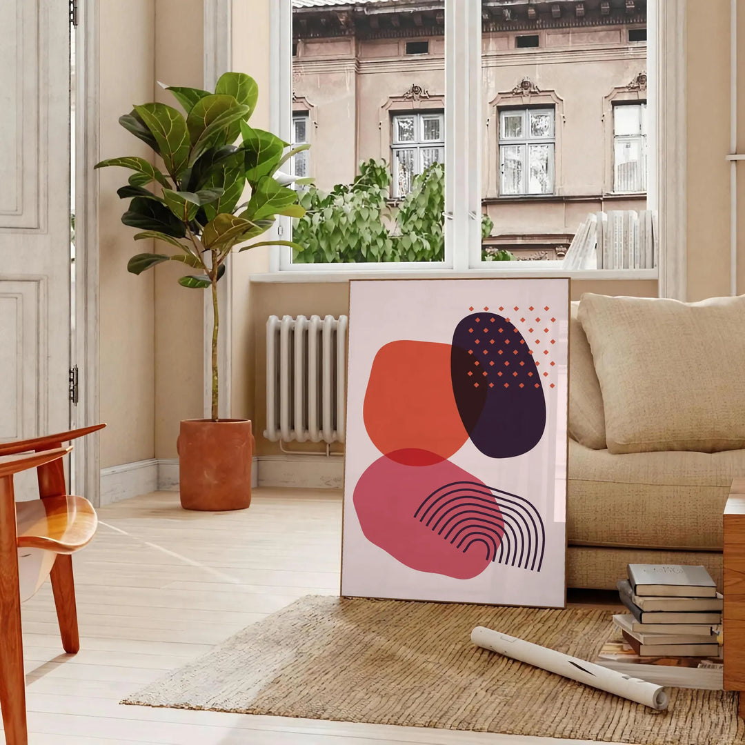 Colorful abstract shapes and patterns in a boho style - in a Parisian living room with a sofa and a fig plant