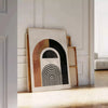 Colorful abstract shapes and patterns in a bohemian style - leaning on a herringbone floor against a white panelled wall