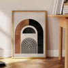Colorful abstract shapes and patterns in a bohemian style - beside a round wooden side table with books