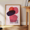 Abstract shapes and patterns in earthy tones with a bohemian style - beside a round wooden side table with books