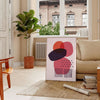 Abstract shapes and patterns in earthy tones with a bohemian style - in a Parisian living room with a sofa and a fig plant