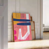 Abstract design featuring orange and blue shapes with a bohemian style - leaning on a herringbone floor against a white panelled wall