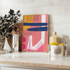 Abstract design featuring orange and blue shapes with a bohemian style - styled on a counter with eucalyptus and a bowl of lemons