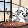 Abstract bohemian design with gray and black tones - leaning on a herringbone floor against a white panelled wall