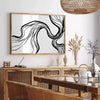 Abstract bohemian design with gray and black tones - in a Parisian living room with a sofa and a fig plant