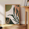 Abstract bohemian design with gray and green tones - beside a round wooden side table with books