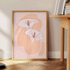 Abstract bohemian design with earthy tones and fluid shapes - beside a round wooden side table with books