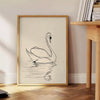 Abstract bohemian design with bold black and orange shapes - beside a round wooden side table with books