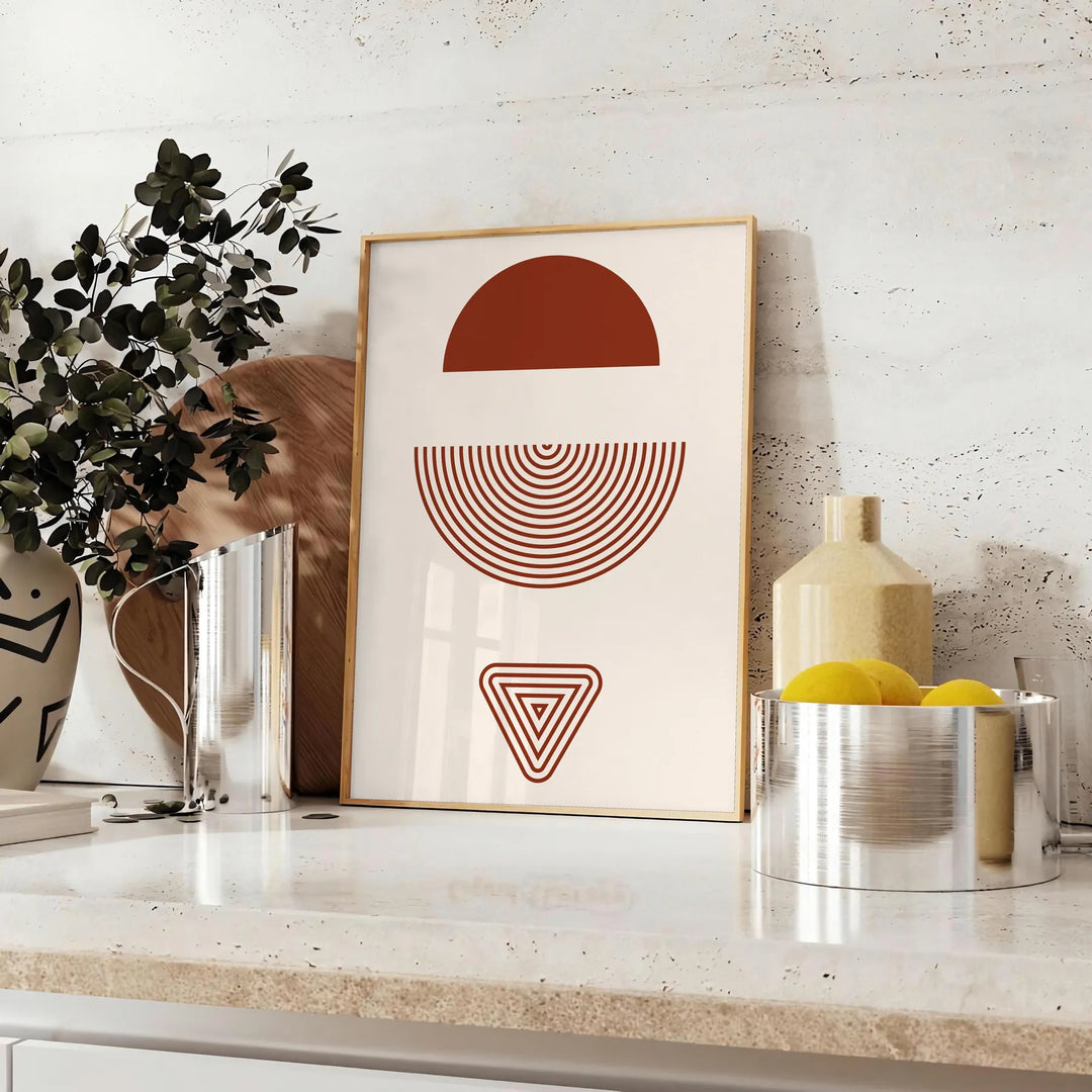 Abstract bohemian design with gray and red hues in a fluid style - styled on a counter with eucalyptus and a bowl of lemons