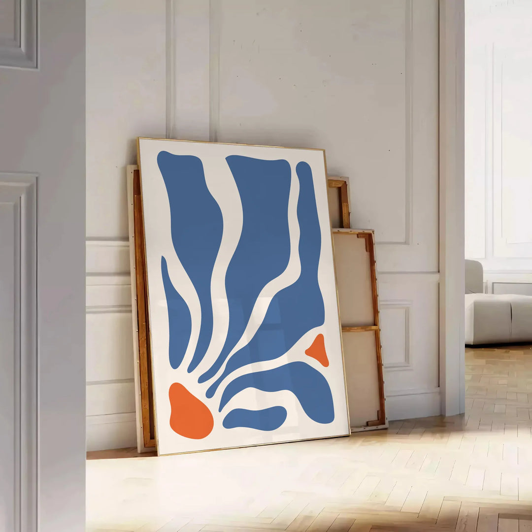 Abstract bohemian design featuring gray and orange hues - leaning on a herringbone floor against a white panelled wall