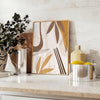 Abstract bohemian design with earthy tones and fluid shapes - styled on a counter with eucalyptus and a bowl of lemons