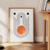 Colorful abstract shapes with a bohemian style and earthy tones - beside a round wooden side table with books