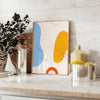 Abstract shapes and patterns in earthy tones with a bohemian style - styled on a counter with eucalyptus and a bowl of lemons