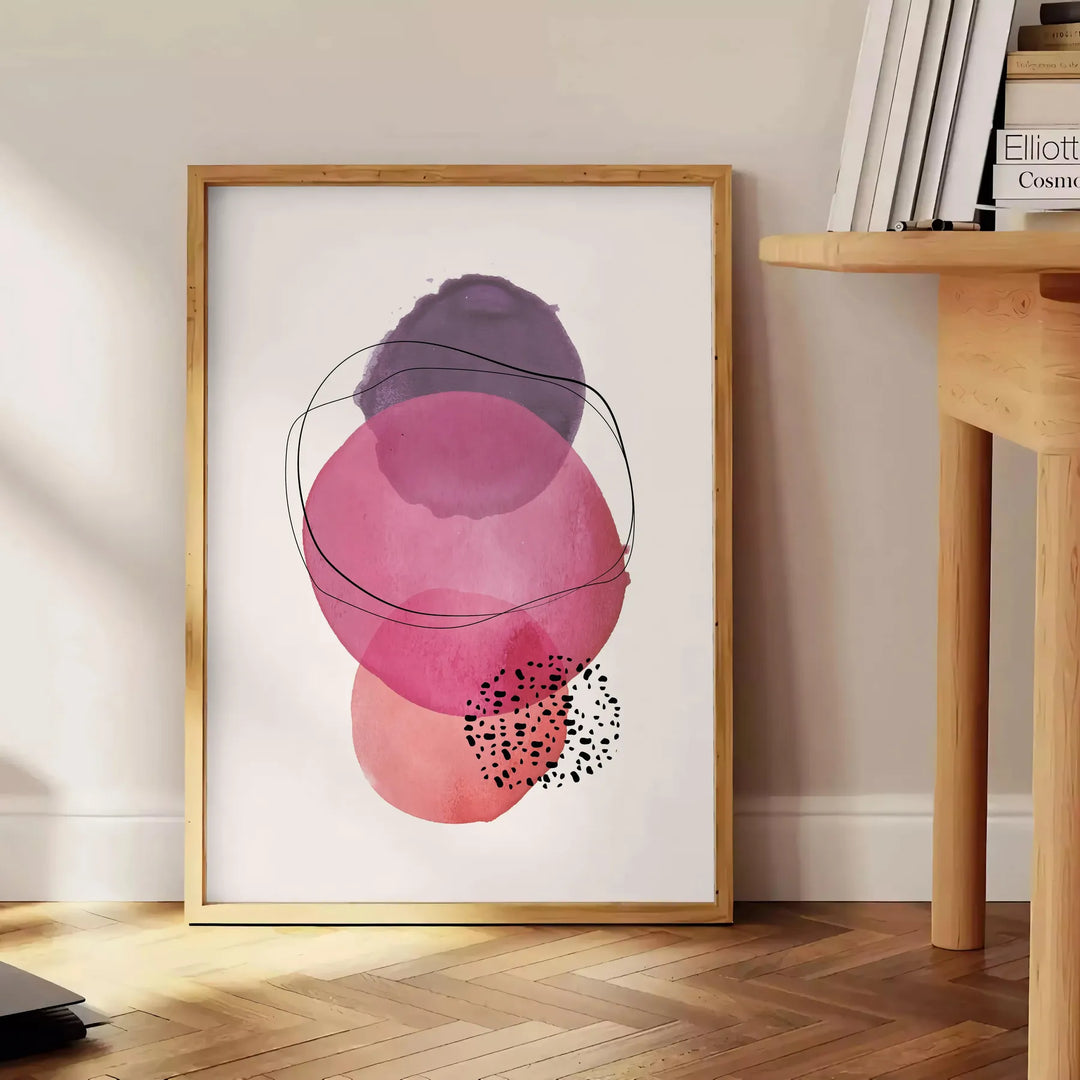 Abstract boho design with earthy tones and organic shapes - beside a round wooden side table with books
