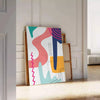 Abstract boho design with swirling shapes in earthy tones - leaning on a herringbone floor against a white panelled wall