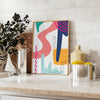 Abstract boho design with swirling shapes in earthy tones - styled on a counter with eucalyptus and a bowl of lemons