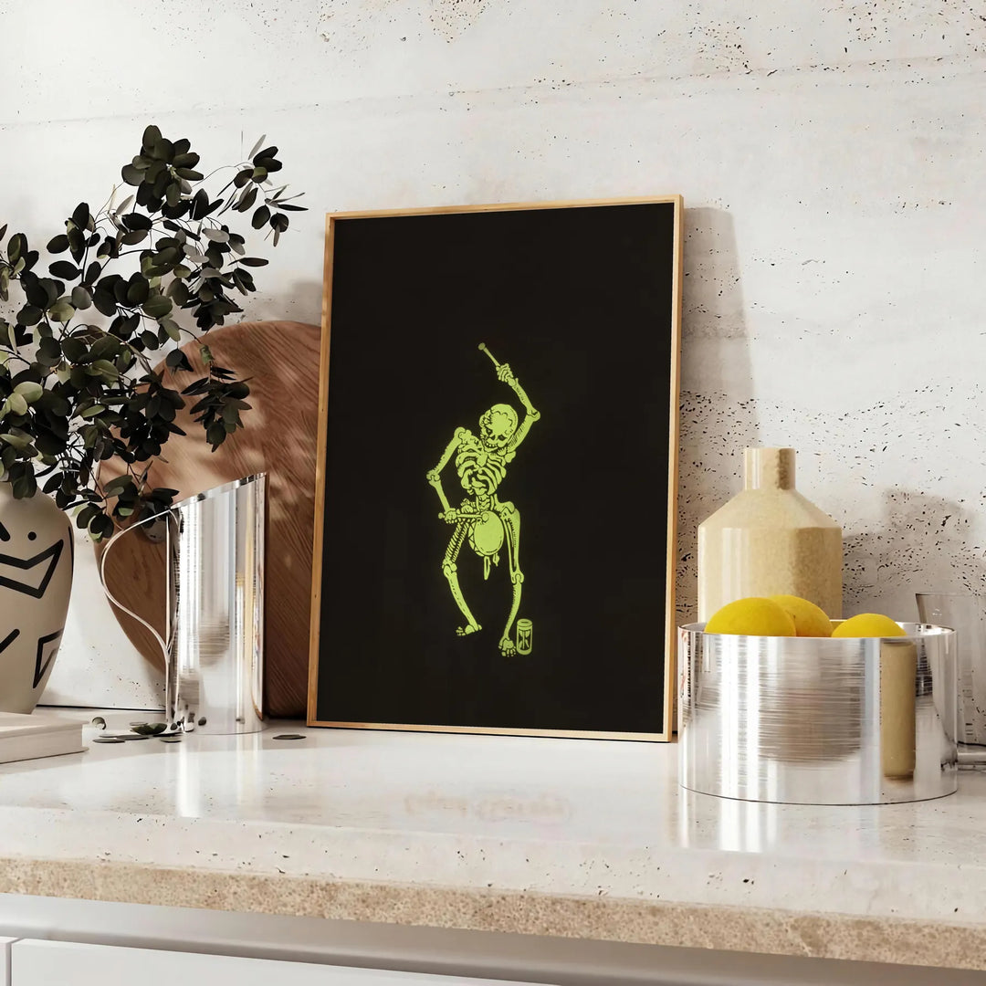 Abstract design featuring bones in black and green hues - styled on a counter with eucalyptus and a bowl of lemons