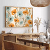 Vintage botanical illustration featuring green leaves and orange flowers - in a Parisian living room with a sofa and a fig plant