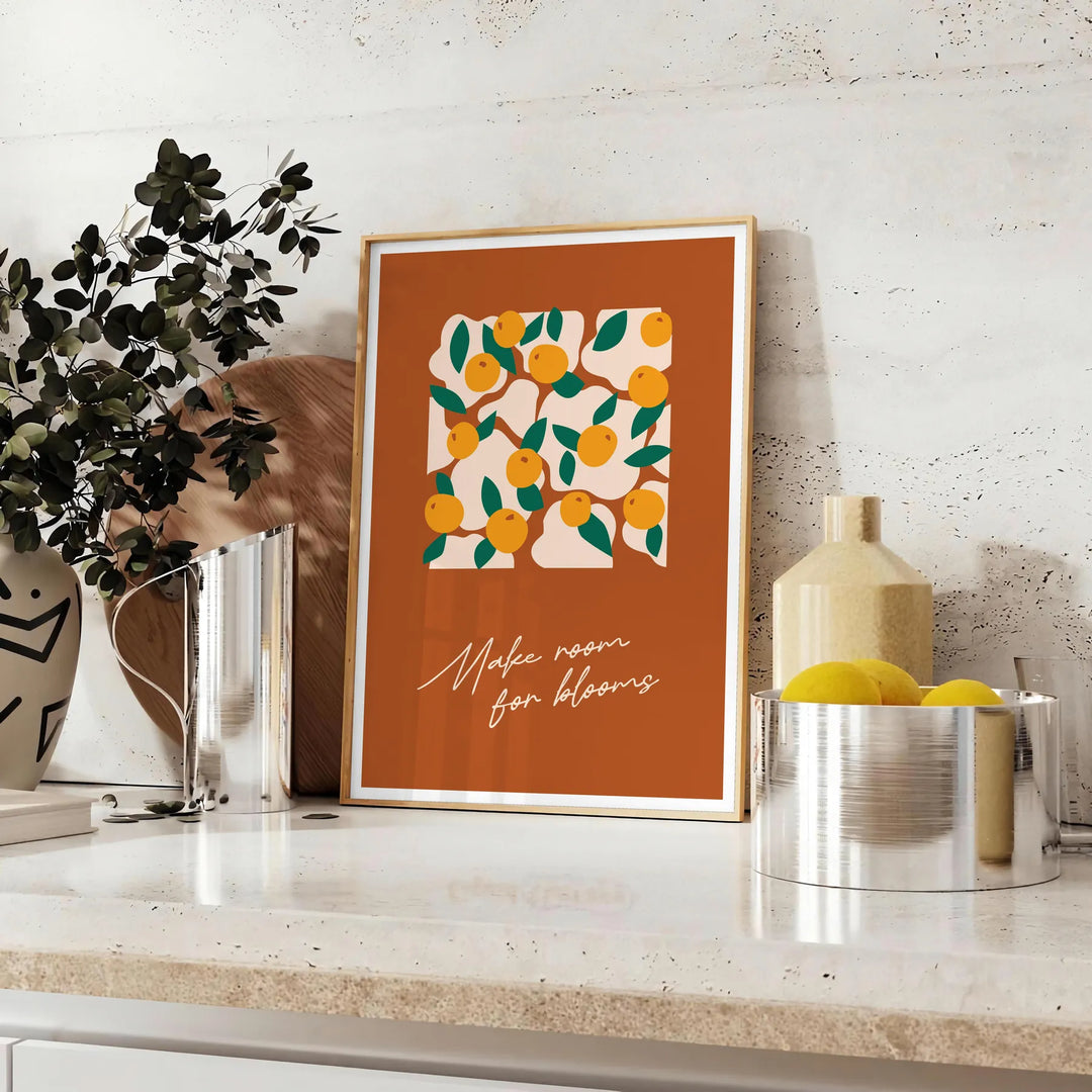 Vintage botanical illustration featuring various green plants and orange flowers - styled on a counter with eucalyptus and a bowl of lemons