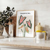Botanical art print featuring orange and gray foliage in a modern style - styled on a counter with eucalyptus and a bowl of lemons