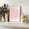 Botanical illustration featuring green leaves and yellow flowers - styled on a counter with eucalyptus and a bowl of lemons