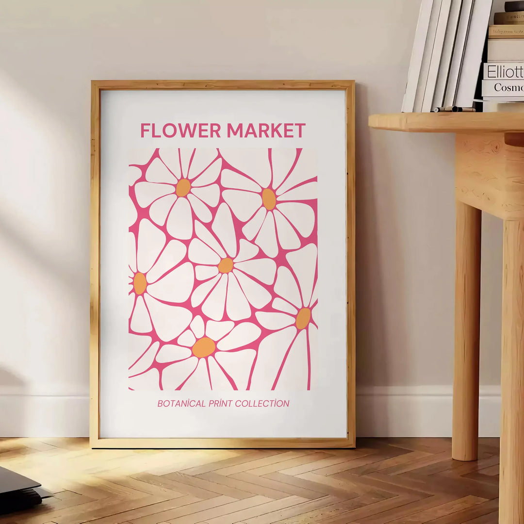 Botanical illustration featuring green leaves and yellow flowers - beside a round wooden side table with books