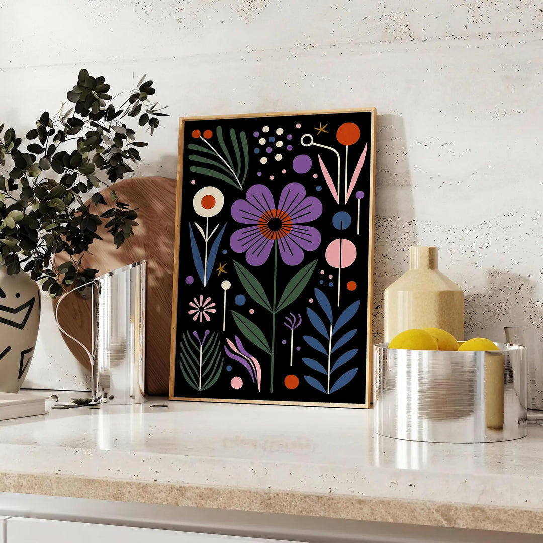 Delicate botanical flowers in a black and green color palette - styled on a counter with eucalyptus and a bowl of lemons