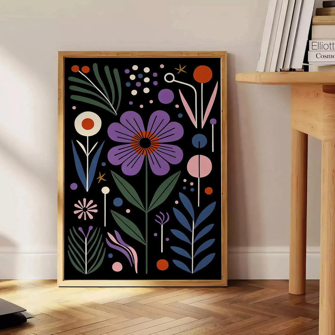 Delicate botanical flowers in a black and green color palette - beside a round wooden side table with books