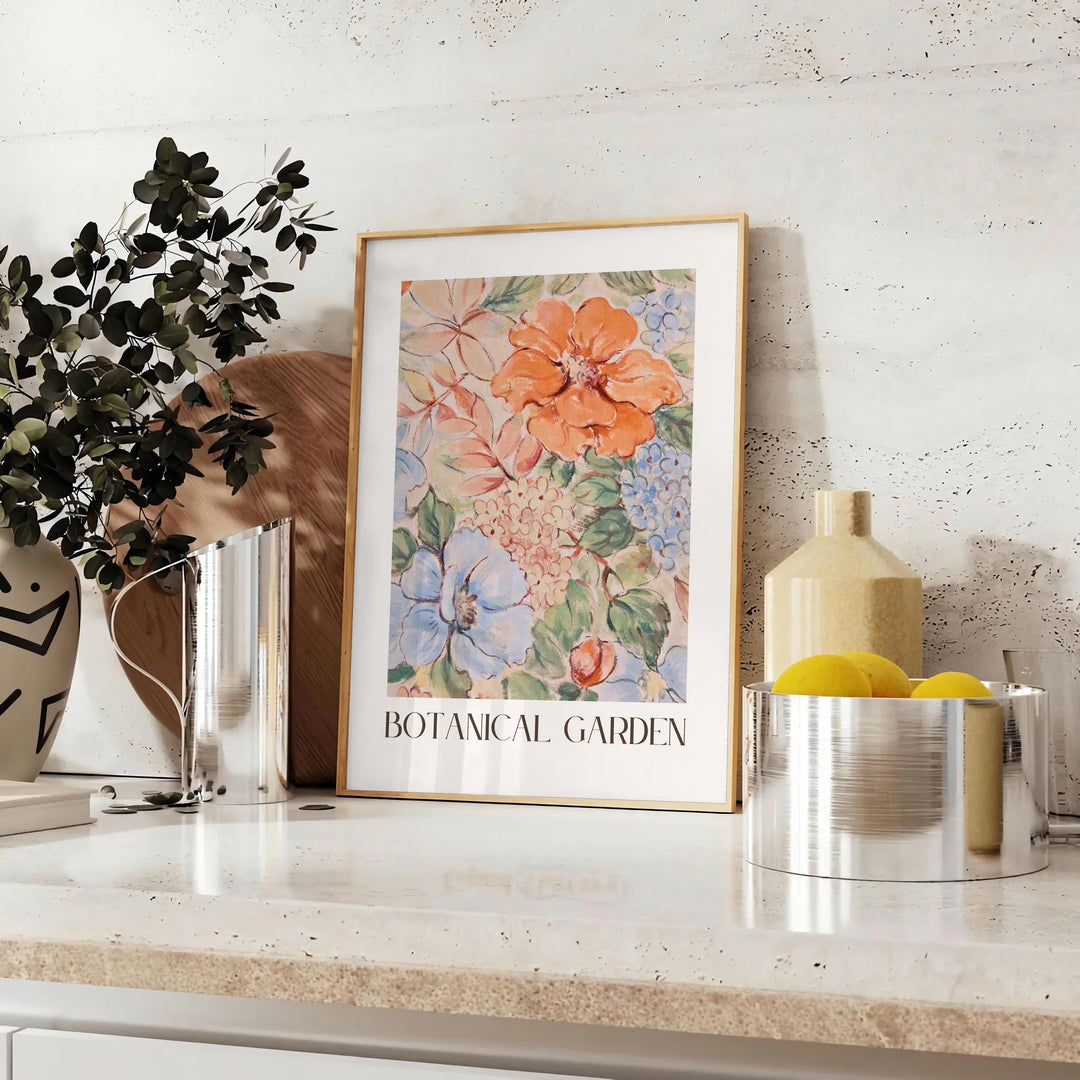 Botanical illustration featuring green leaves and orange flowers - styled on a counter with eucalyptus and a bowl of lemons