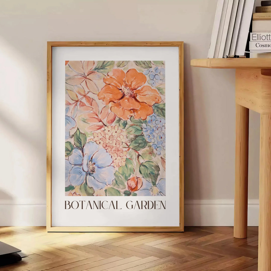 Botanical illustration featuring green leaves and orange flowers - beside a round wooden side table with books