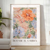 Botanical illustration featuring green leaves and orange flowers - in a bright minimalist room with a plant and an armchair