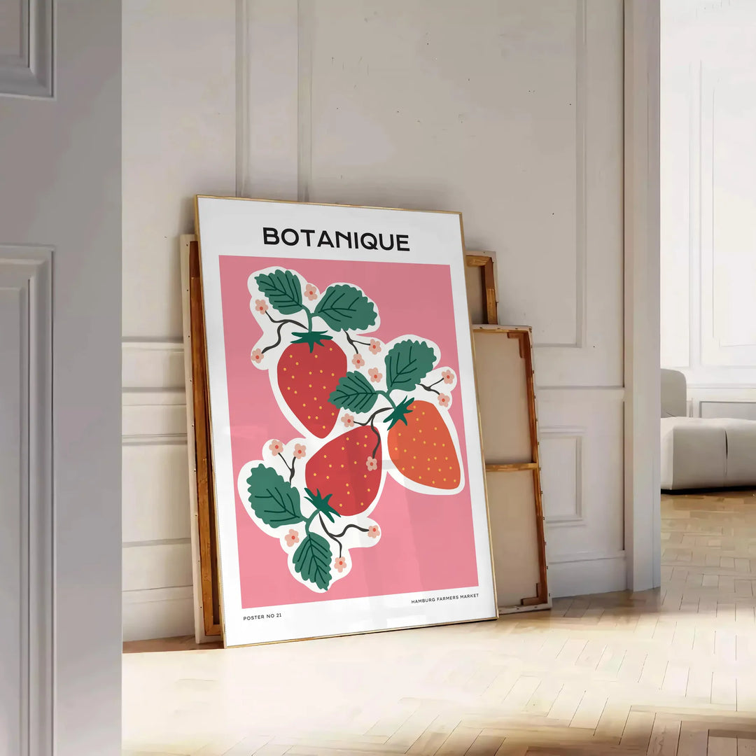 A vintage botanical print featuring orange and blue hues with various plants. - leaning on a herringbone floor against a white panelled wall