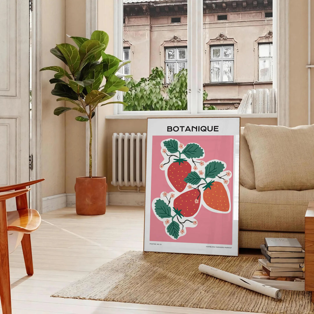 A vintage botanical print featuring orange and blue hues with various plants. - in a Parisian living room with a sofa and a fig plant