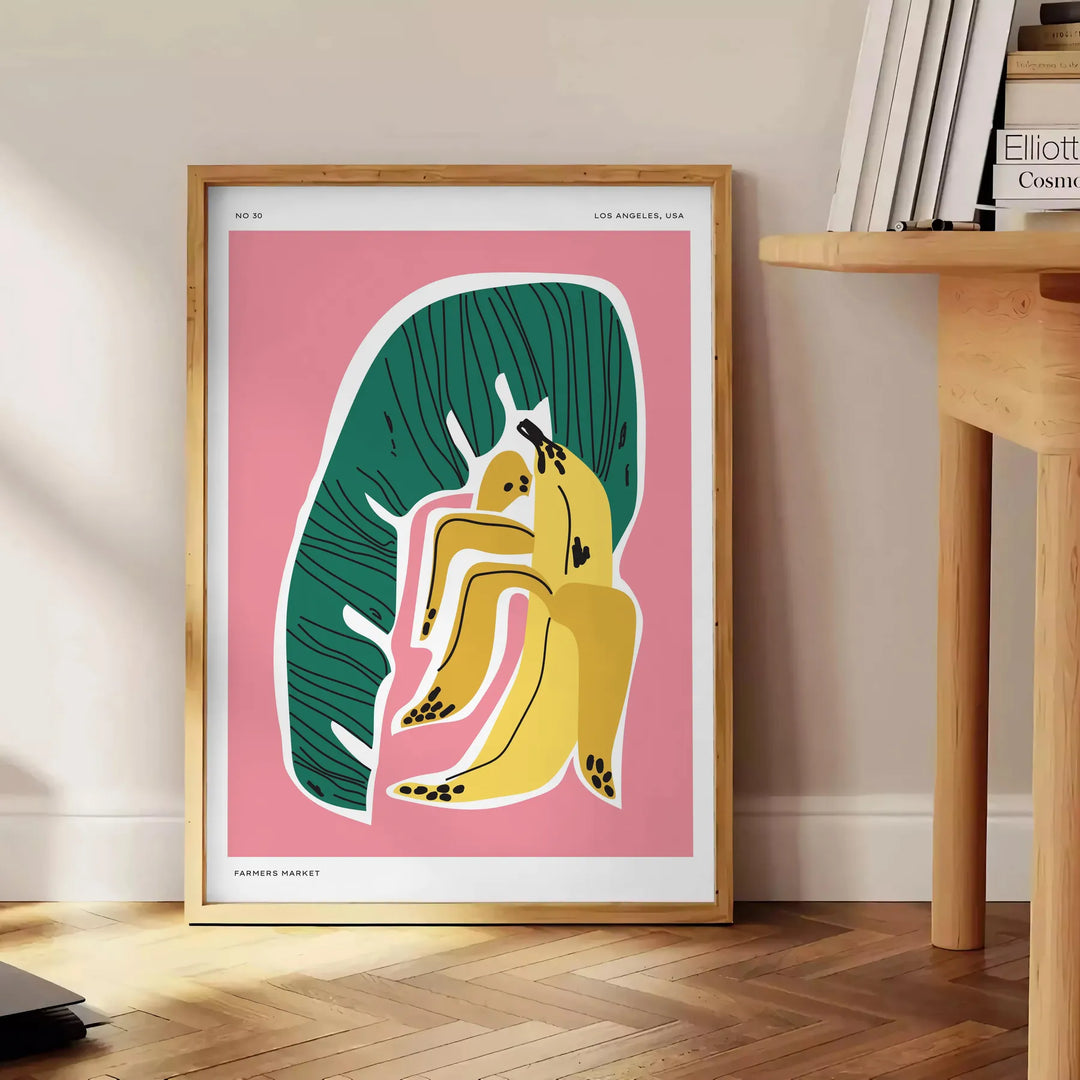 Lush green botanical illustration with vivid orange accents - beside a round wooden side table with books