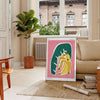 Lush green botanical illustration with vivid orange accents - in a Parisian living room with a sofa and a fig plant