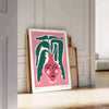 Botanical illustration featuring green foliage and delicate flowers on a soft gray background - leaning on a herringbone floor against a white panelled wall