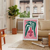 Botanical illustration featuring green foliage and delicate flowers on a soft gray background - in a Parisian living room with a sofa and a fig plant