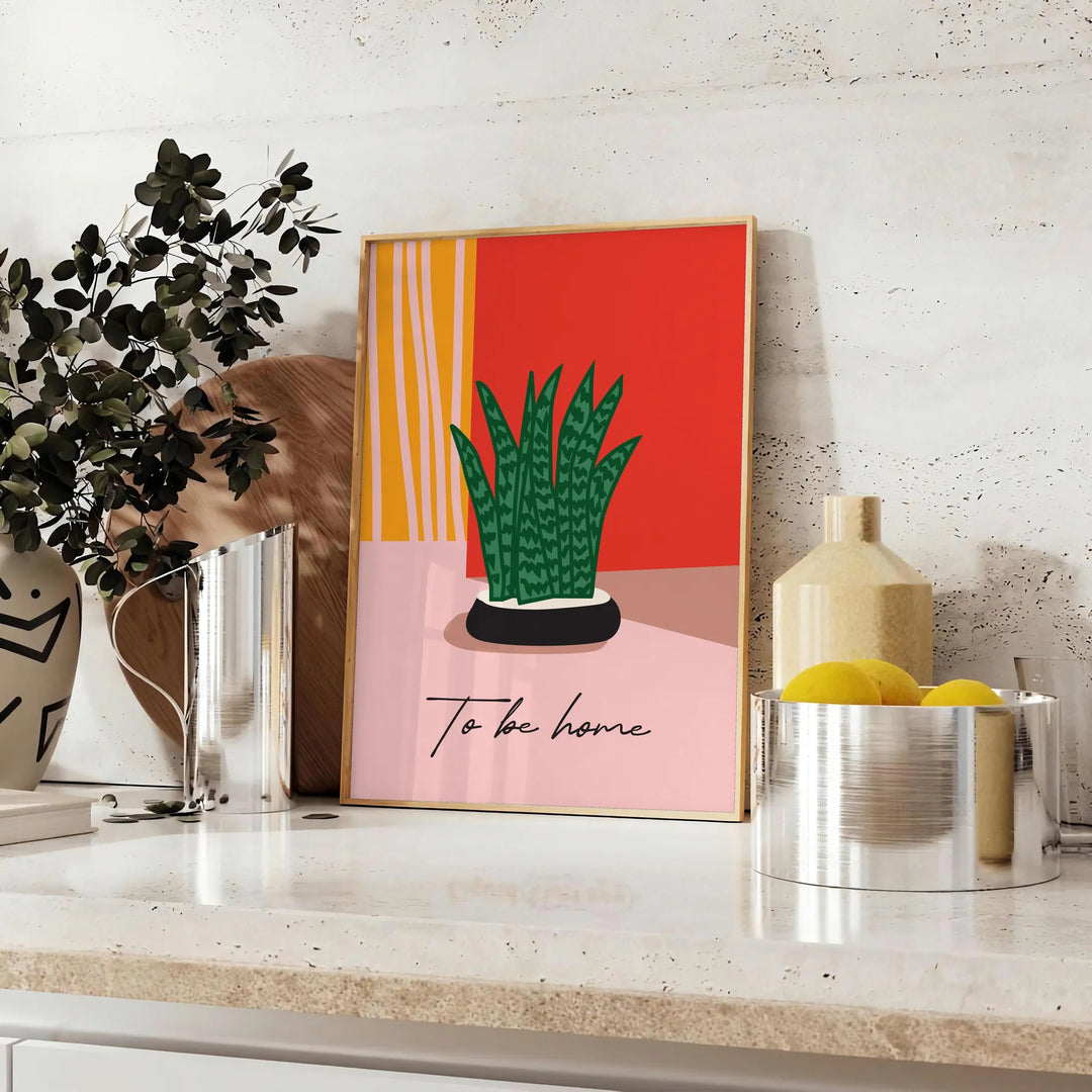 Botanical illustration featuring green leaves and orange flowers on a light background - styled on a counter with eucalyptus and a bowl of lemons