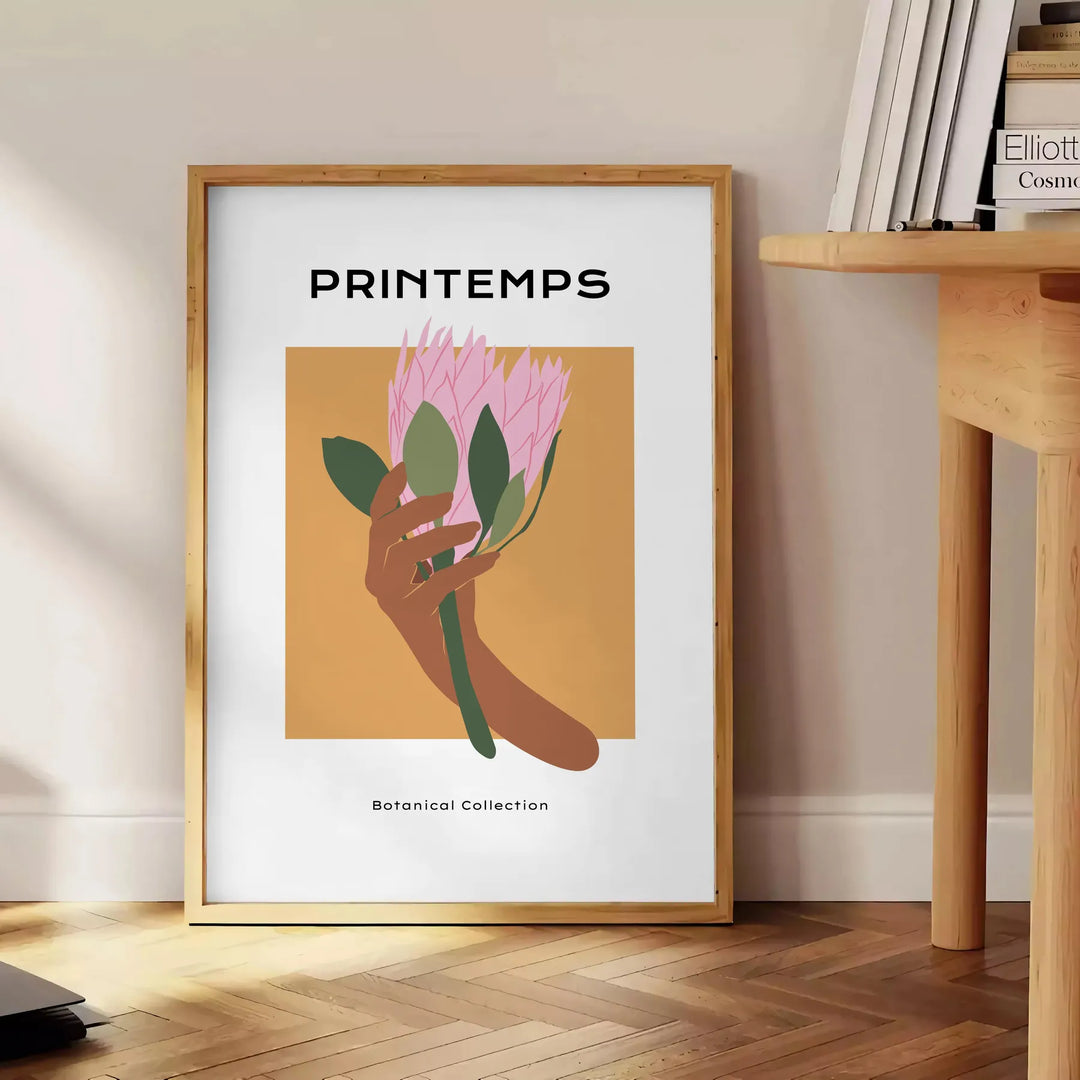 Botanical illustration featuring lush green leaves and vibrant orange flowers - beside a round wooden side table with books