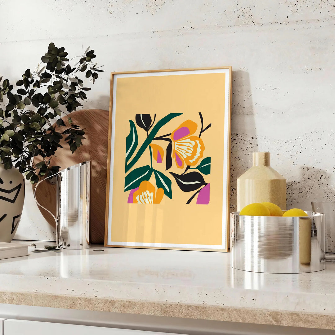 Botanical print featuring yellow flowers with bold black details - styled on a counter with eucalyptus and a bowl of lemons