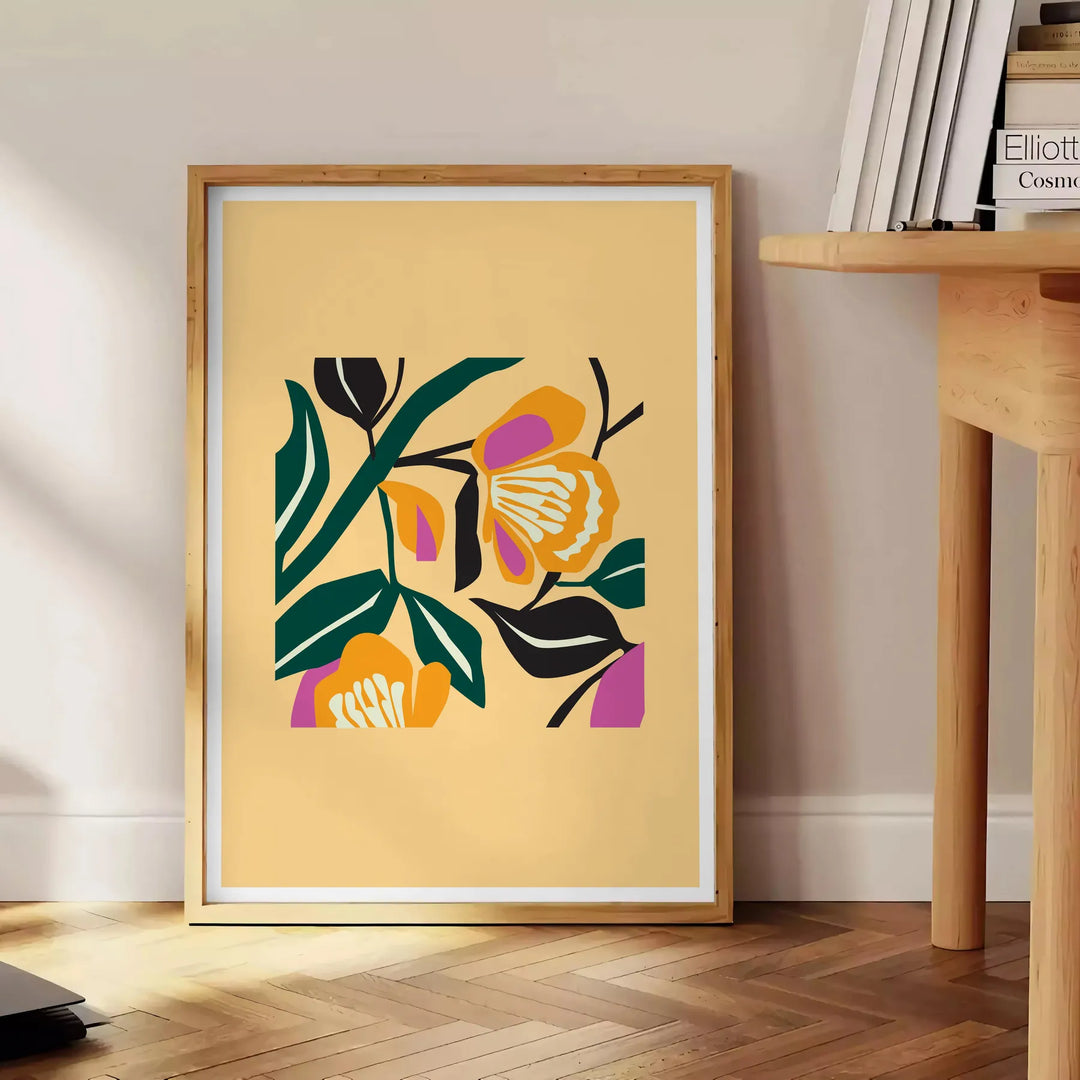 Botanical print featuring yellow flowers with bold black details - beside a round wooden side table with books