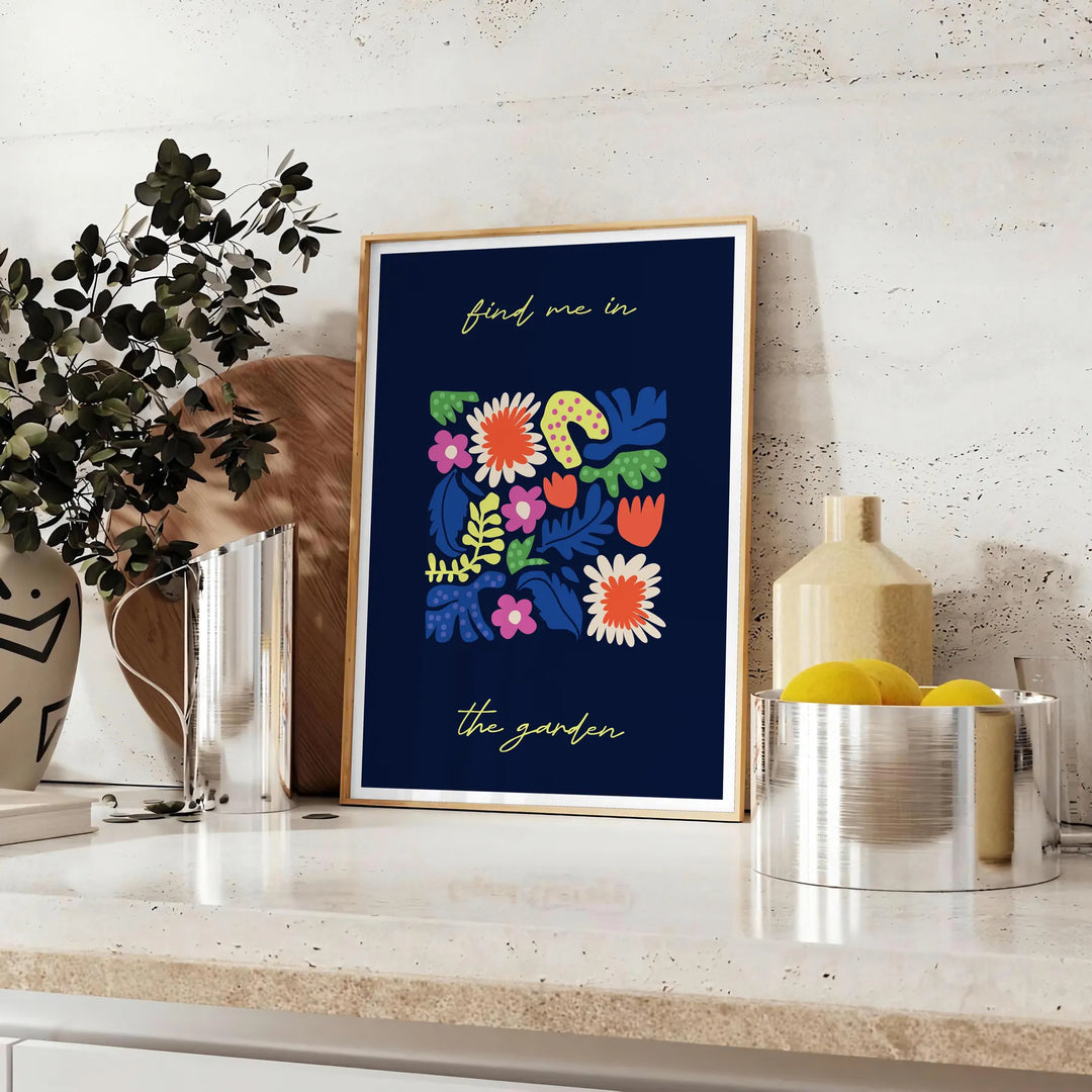 Botanical print featuring lush green plants against a sleek black background - styled on a counter with eucalyptus and a bowl of lemons