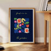 Botanical print featuring lush green plants against a sleek black background - beside a round wooden side table with books