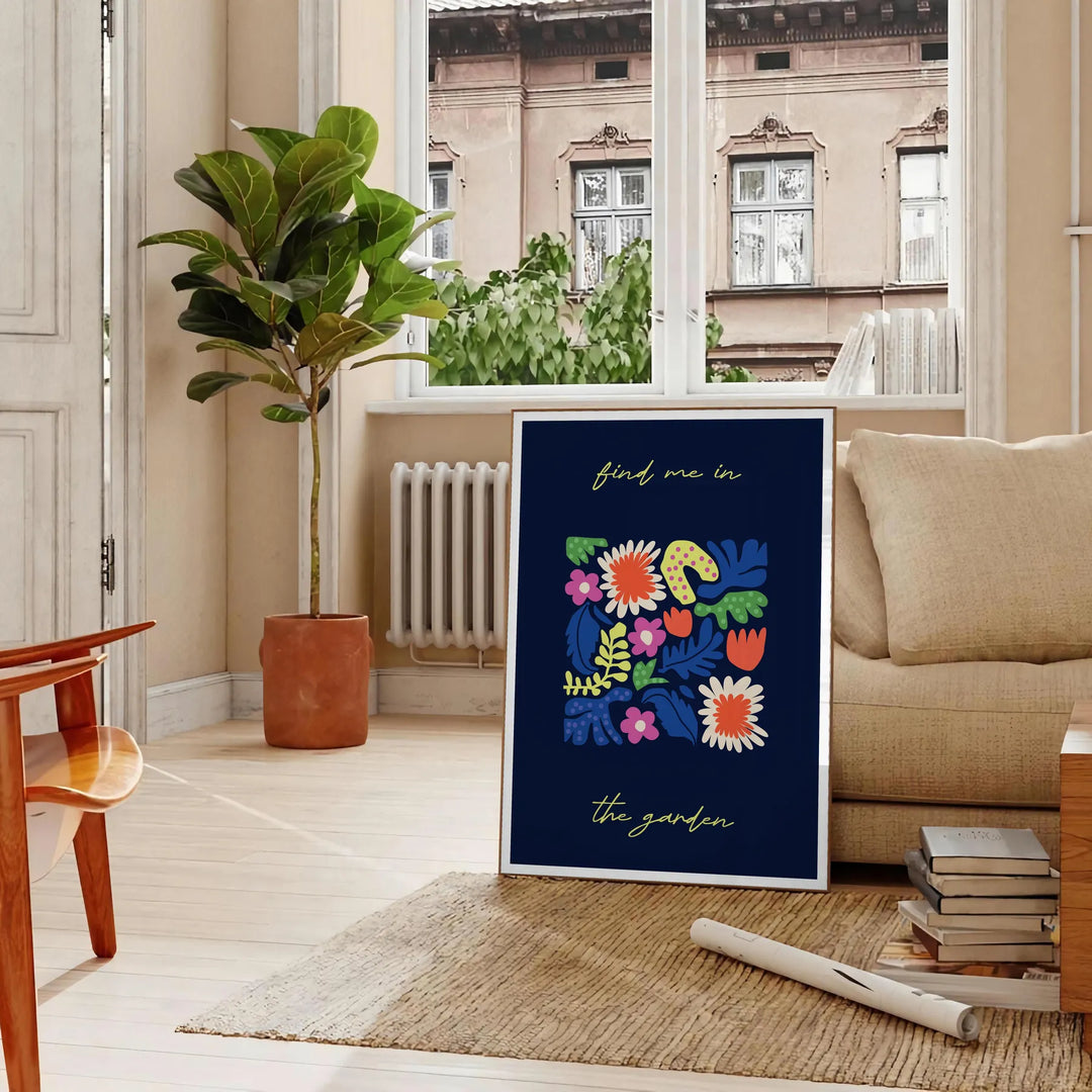 Botanical print featuring lush green plants against a sleek black background - in a Parisian living room with a sofa and a fig plant