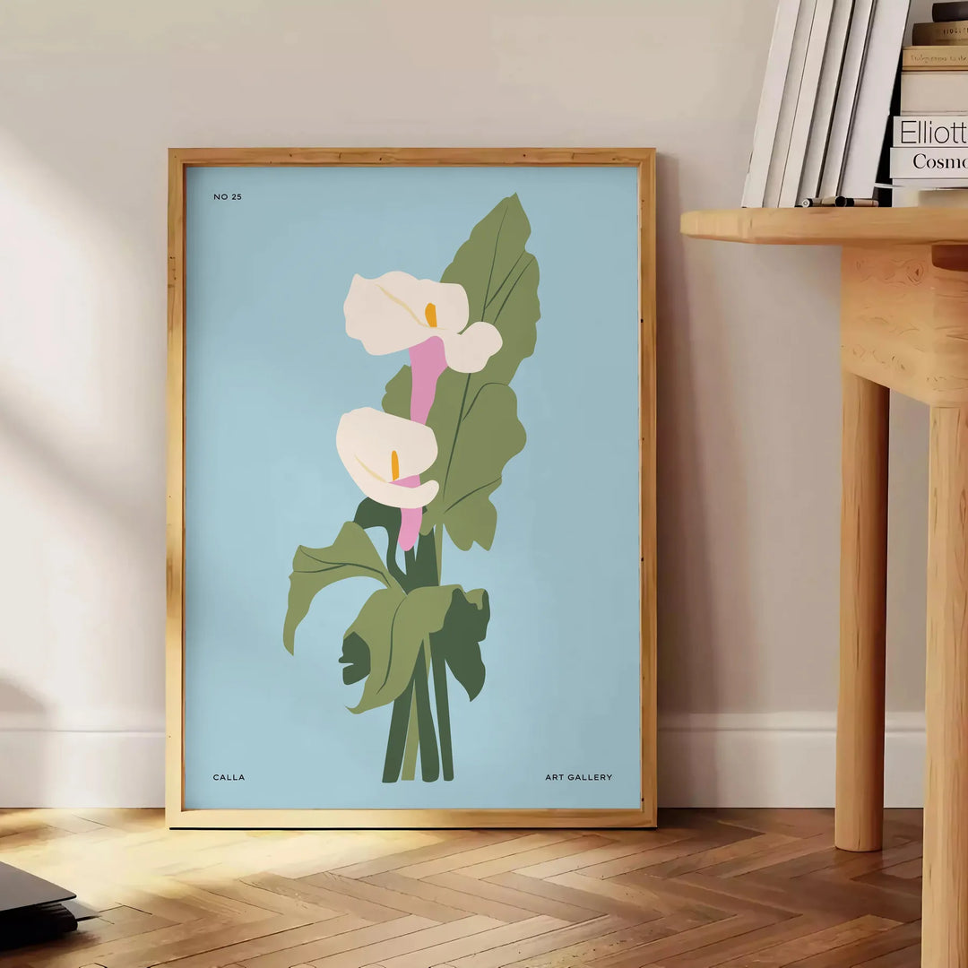 Vintage botanical illustration featuring blue and gray plant motifs - beside a round wooden side table with books