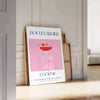 Illustration of a Boulevardier cocktail with orange and blue accents - leaning on a herringbone floor against a white panelled wall