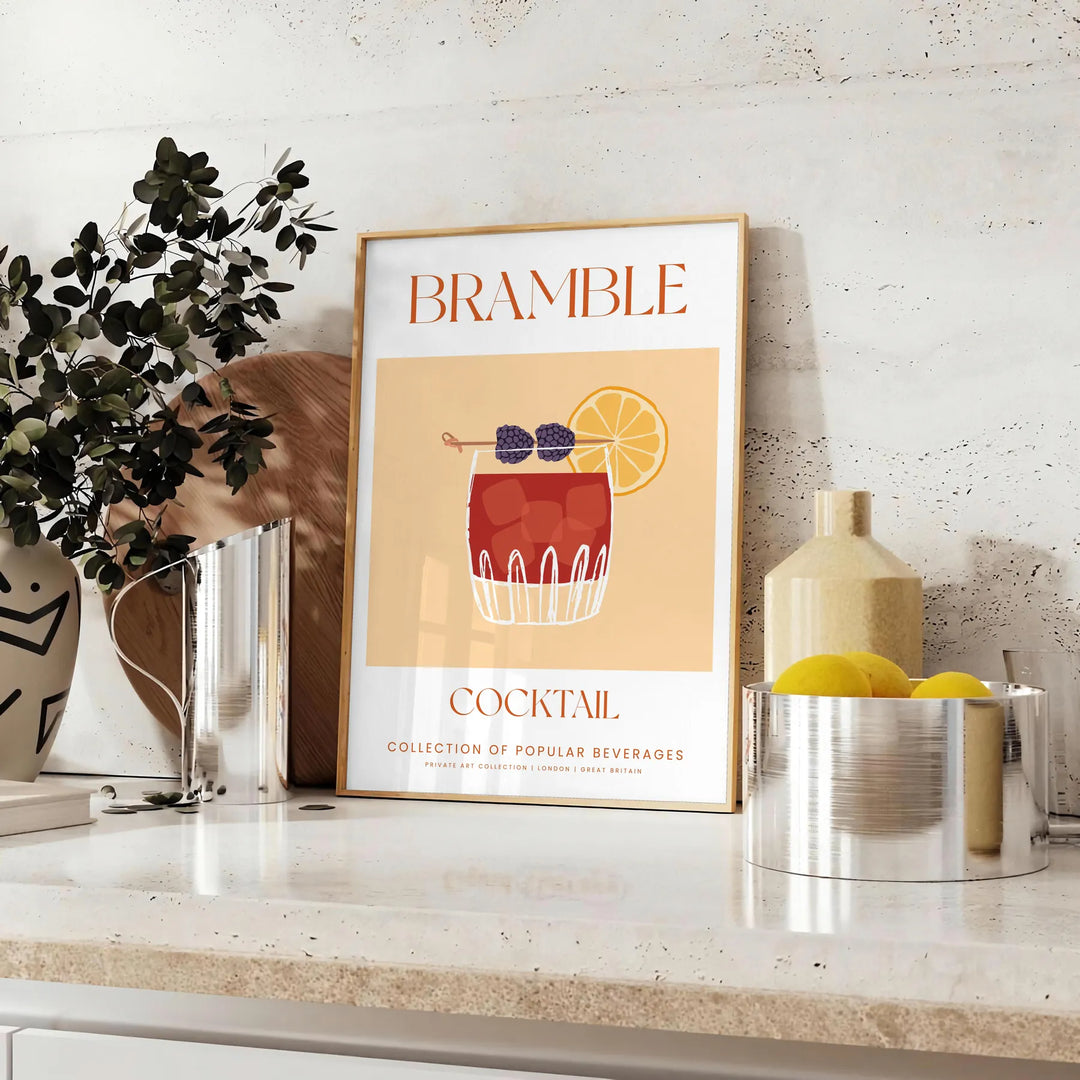 Abstract illustration of a bramble cocktail with orange and blue splashes - styled on a counter with eucalyptus and a bowl of lemons